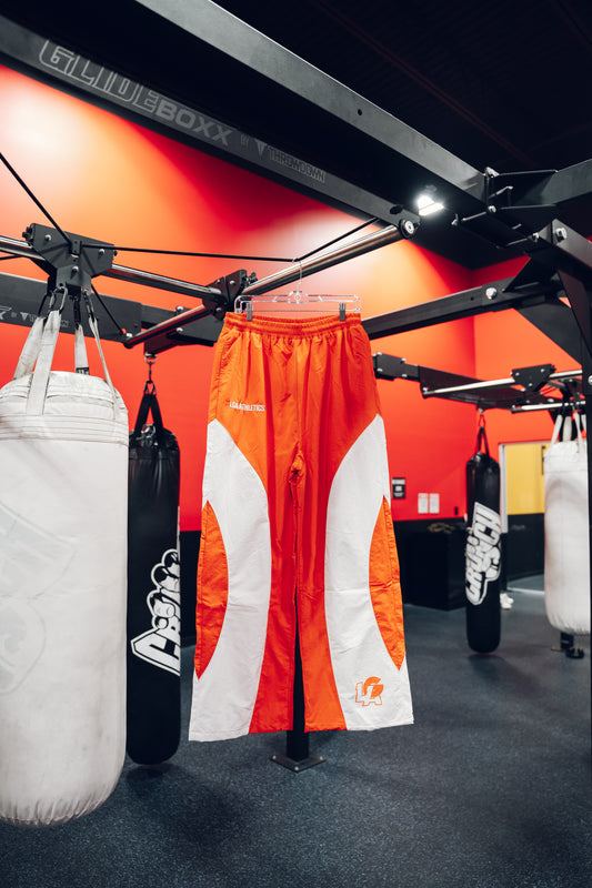 RED POWER MOVES BAGGY TRACKPANTS